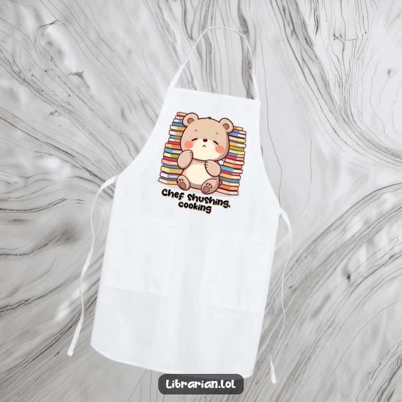 Funny Apron: A diligent bear places a paw over its mouth to shush, surrounded by stacks, ideal for quiet kitchen work.