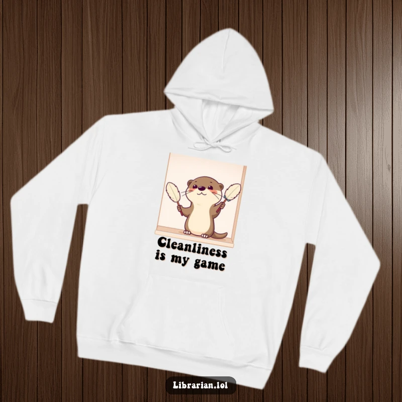 Funny Hoodie with a satisfied cartoon otter carefully dusting a shelf with a feather duster, showcasing a clean and happy vibe.