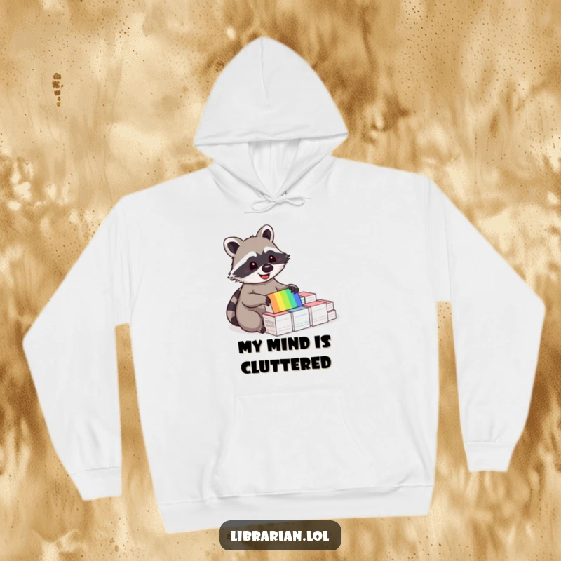 Funny hoodie featuring a delighted raccoon meticulously sorting through a rainbow of index cards, perfect for cozy organization.