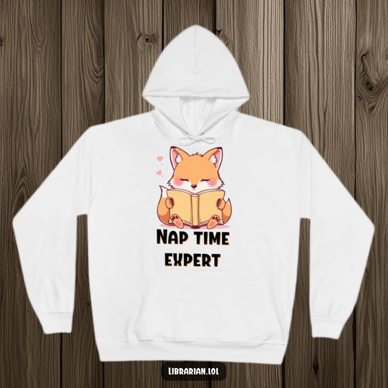 Funny Hoodie: A cute fox has fallen asleep while reading an open book.
