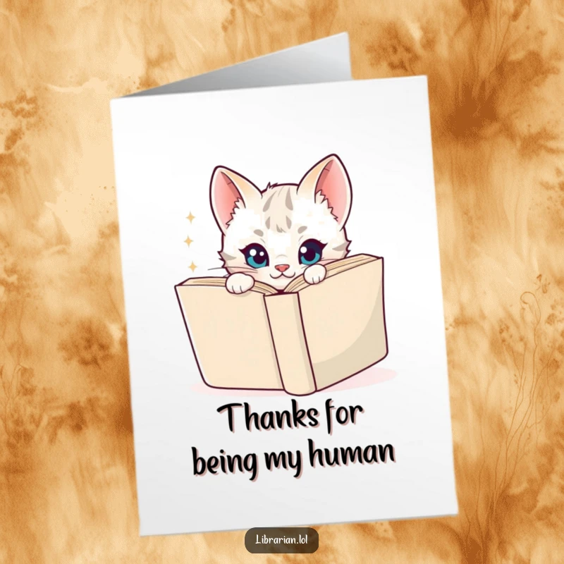 Funny Free Printable Thank You Card: Playful kitten peeking from behind a book, sparkly eyes, cute thanks.