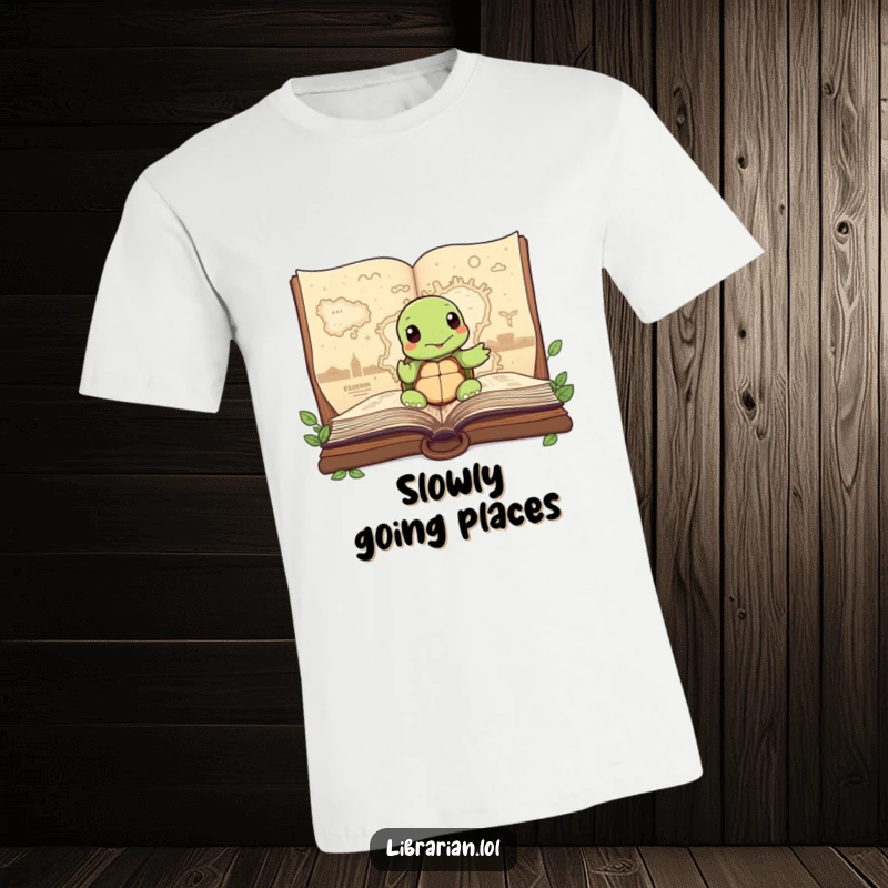 Funny Turtle T-Shirt, wisely pointing at a map within a large storybook, perfect for those who love exploration and wisdom.