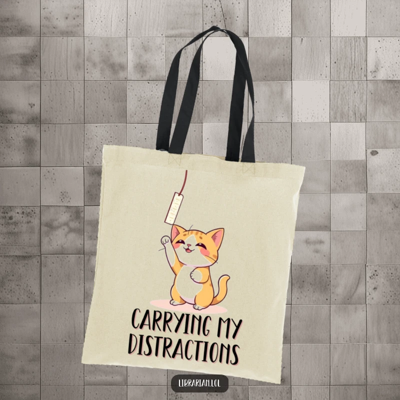 Funny Cat Bookmark Tote Bag: A playful cat bats with joy at a dangling bookmark.