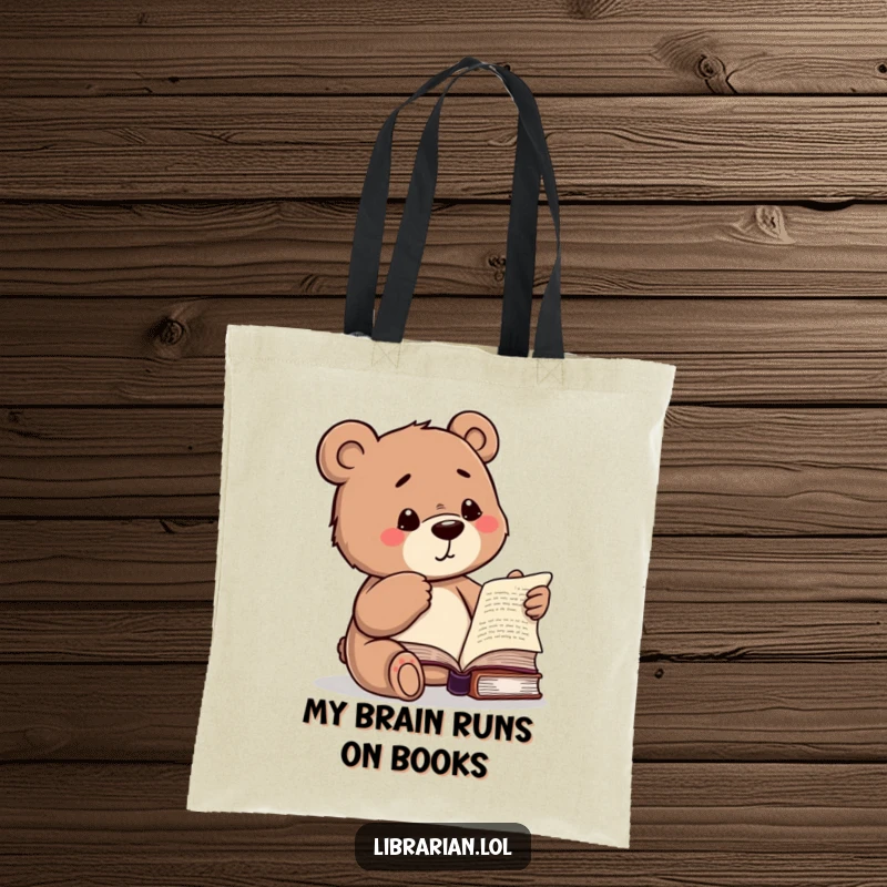 Funny tote bag with a studious bear winking while pointing to a book, ideal for carrying books with style.