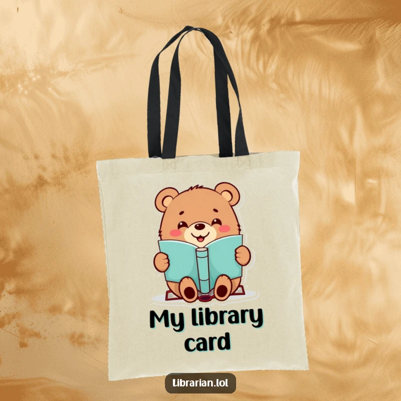 Funny tote bag showcasing a happy bear stamping a book, perfect for carrying literary treasures and smiles.